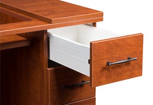 Desk with a drawer pulled out.
